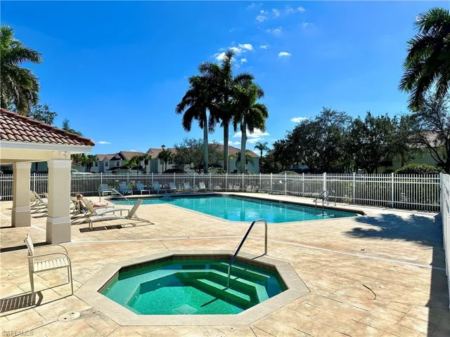 Community pool with a patio, a community hot tub, and a gazebo