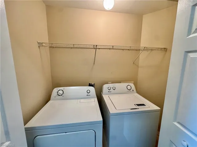 Laundry area with washing machine and clothes dryer