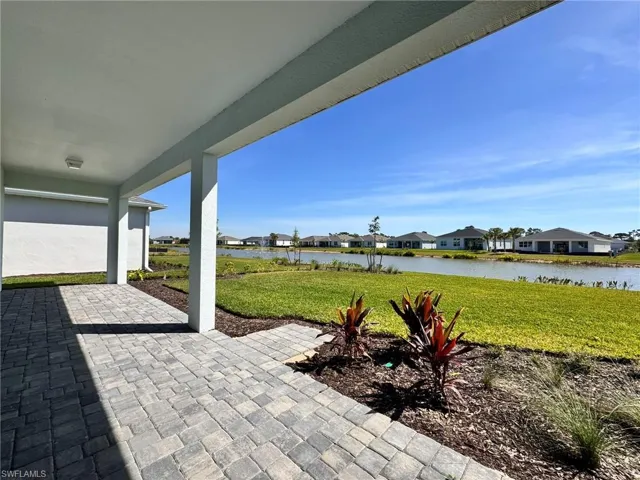 View of patio featuring a residential view and a water view