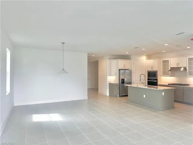 Casual dining area and kitchen with Whirlpool appliances