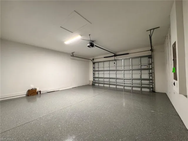 Garage featuring a garage door opener