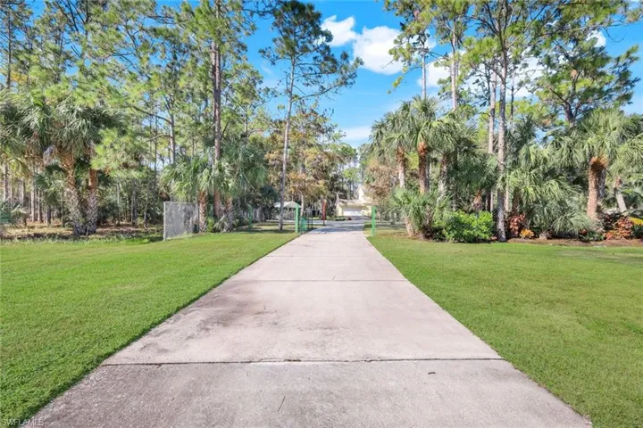 View of property's community featuring a yard