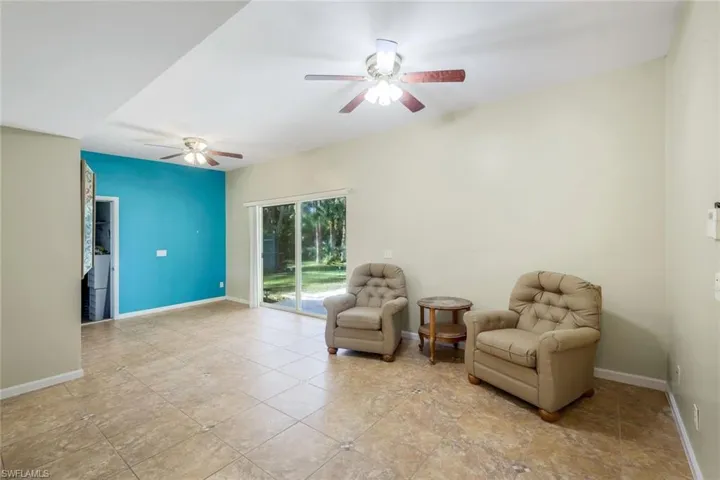 Living area featuring ceiling fan