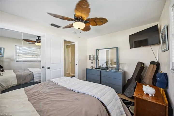 Bedroom featuring ceiling fan and a closet