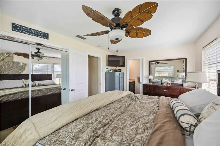 Bedroom with a closet and a ceiling fan