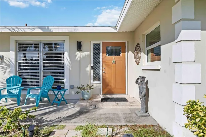 Property entrance with stucco siding