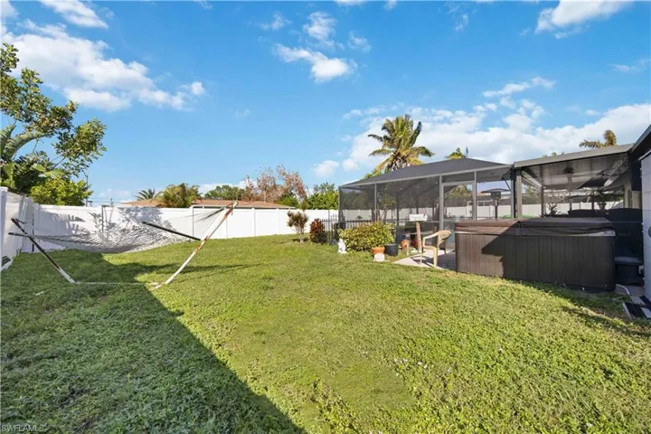 View of yard with a hot tub