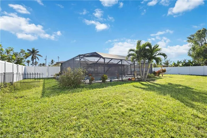 View of yard with a lanai