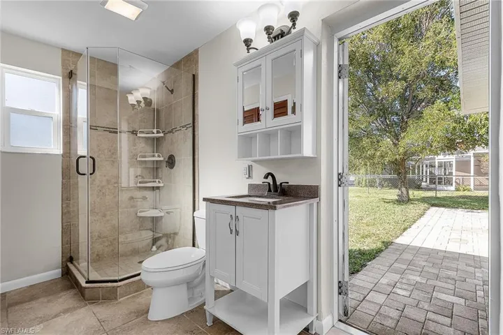 Bathroom featuring vanity and a stall shower