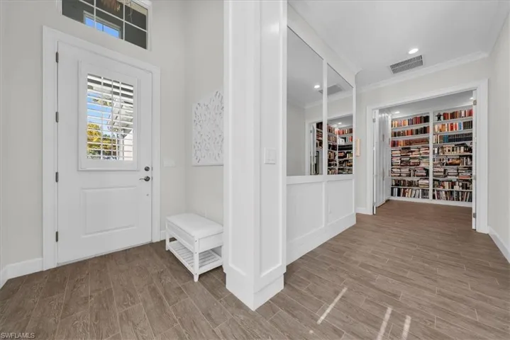 Full bathroom with double vanity, a shower stall, recessed lighting, and light tile patterned flooring