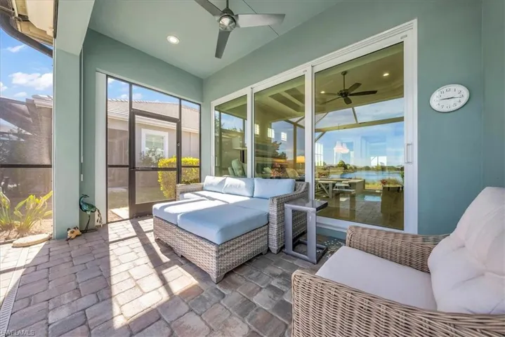 Sunroom with a patio, ceiling fan, and outdoor lounge area