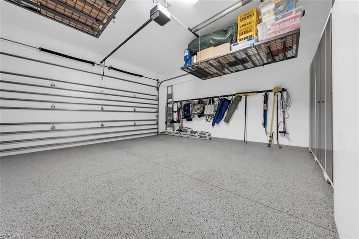 Bedroom with wood tiled floors and a ceiling fan