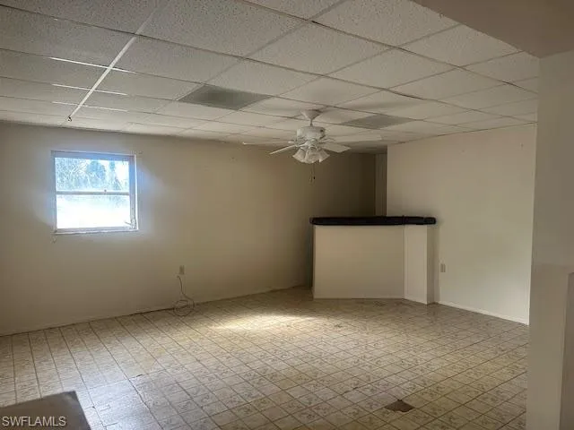 Family room/Dining Room featuring a paneled ceiling and ceiling fan
