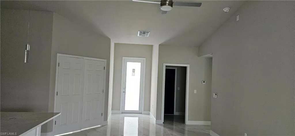 Entrance foyer featuring ceiling fan