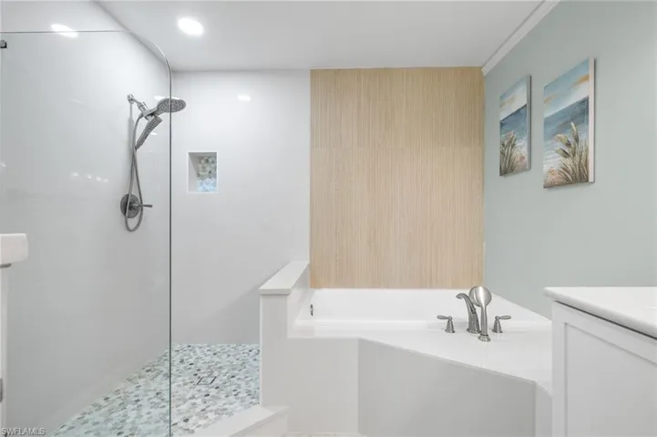 Bathroom with vanity and plus walk in shower