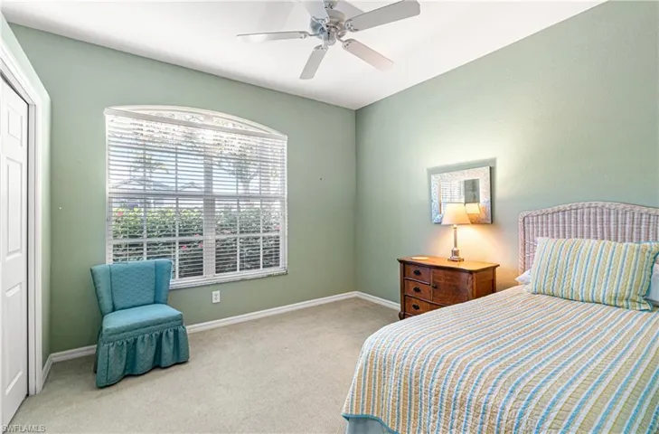 Bedroom with carpet flooring and ceiling fan