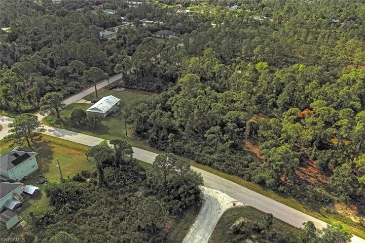 View of property location featuring a heavily wooded area
