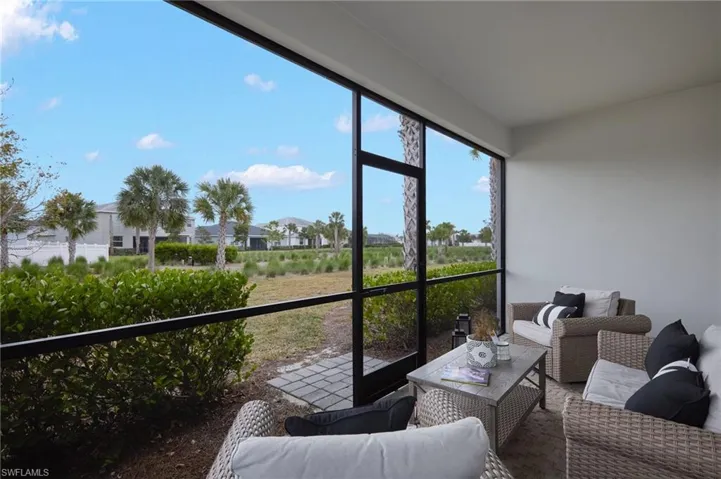Screened lanai with an outdoor landscaped area
