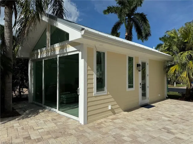 View of side of property with a patio