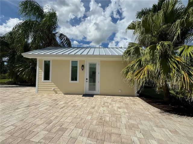 Back of property featuring a patio area
