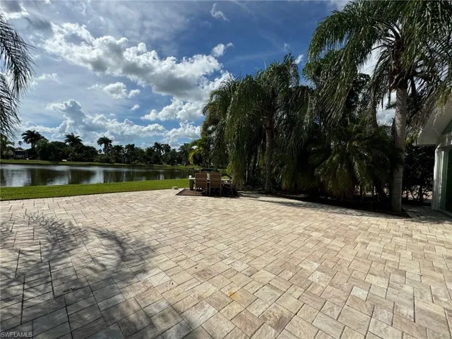 View of home's community featuring a patio and a water view
