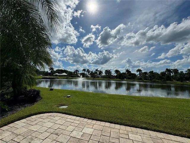View of home's community featuring a patio and a water view