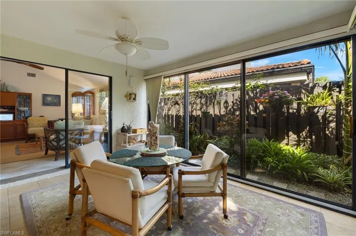 Sunroom / solarium featuring a ceiling fan and visible vents
