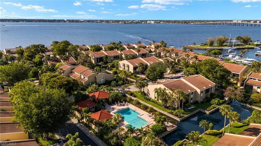 Drone / aerial view with a water view and a residential view