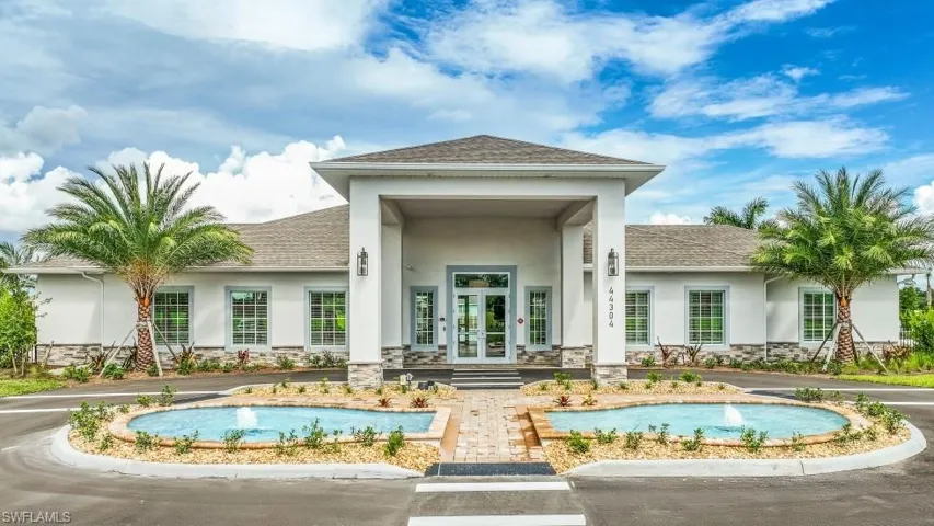 Back of property featuring french doors