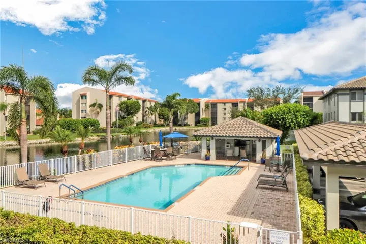 View of swimming pool featuring a gazebo, a water view, and a patio area