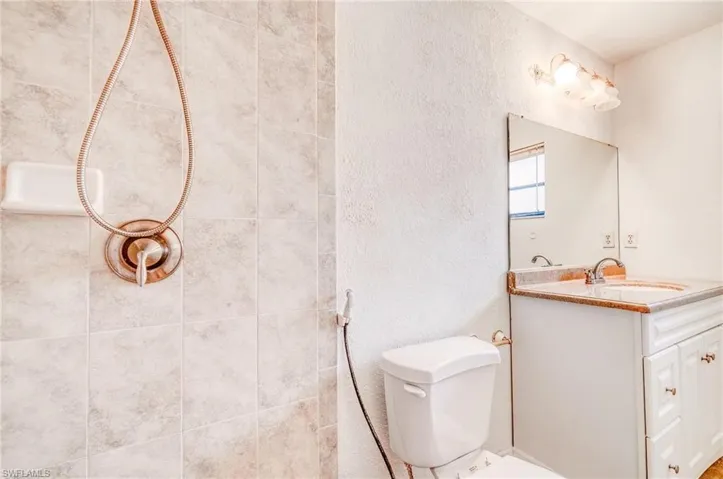 Bathroom featuring vanity and toilet