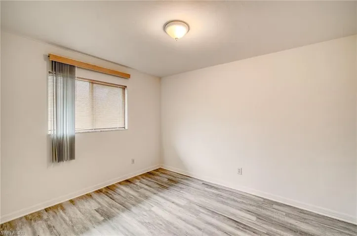 Empty room with light wood-type flooring