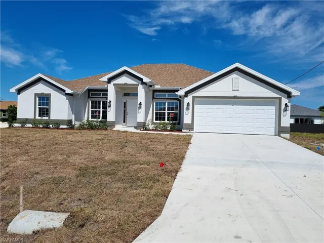 Ranch-style house with a garage, driveway, roof with shingles, stucco siding, and a front lawn