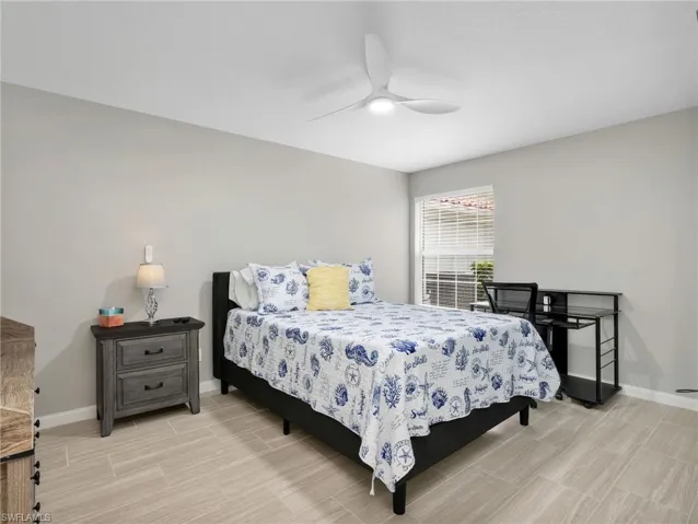 Bedroom with baseboards and ceiling fan
