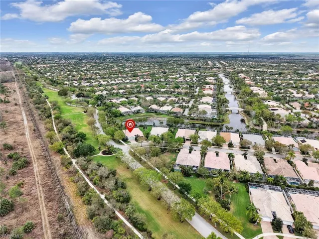 Aerial perspective of suburban area with a nearby body of water