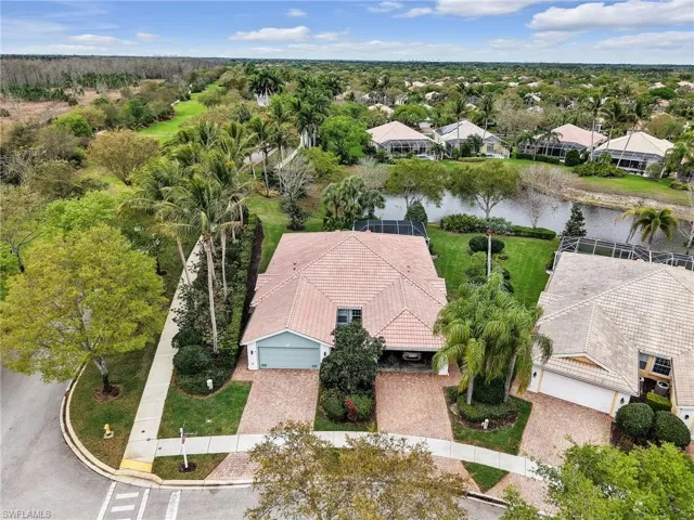 Aerial perspective of suburban area with a large body of water