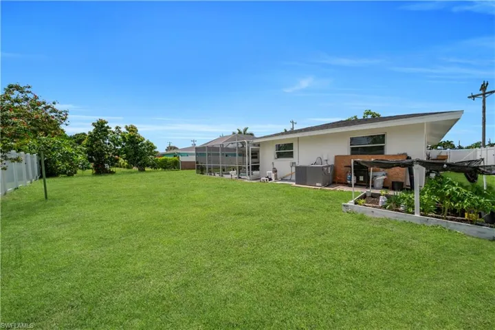 View of yard featuring glass enclosure