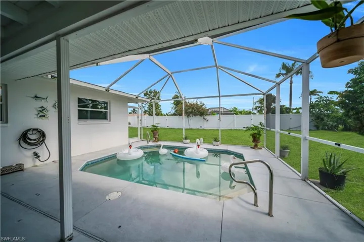 View of swimming pool featuring a patio, a lanai, and a fenced backyard