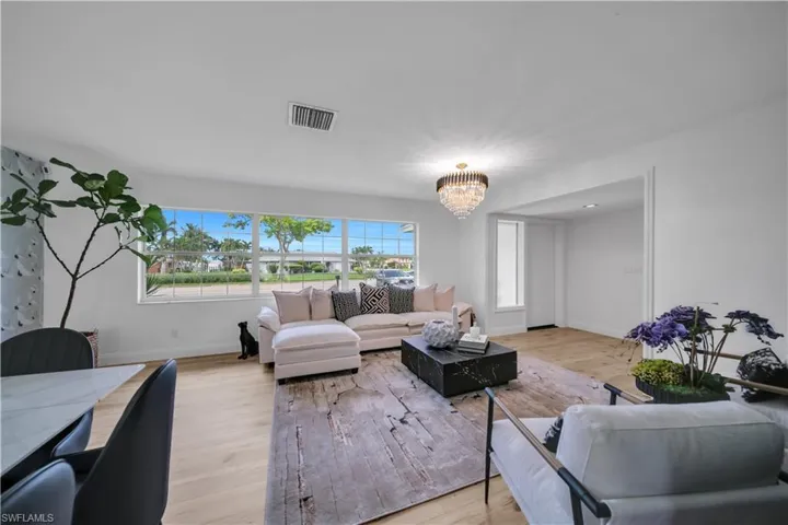 Living room with a chandelier and wood finished floors