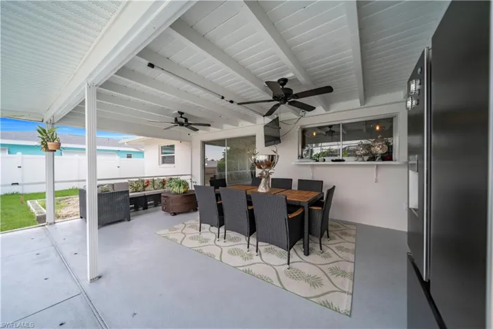 View of patio / terrace featuring outdoor dining space and ceiling fan