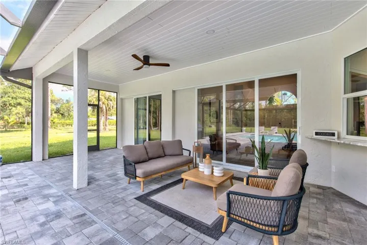 View of patio featuring ceiling fan and an outdoor hangout area