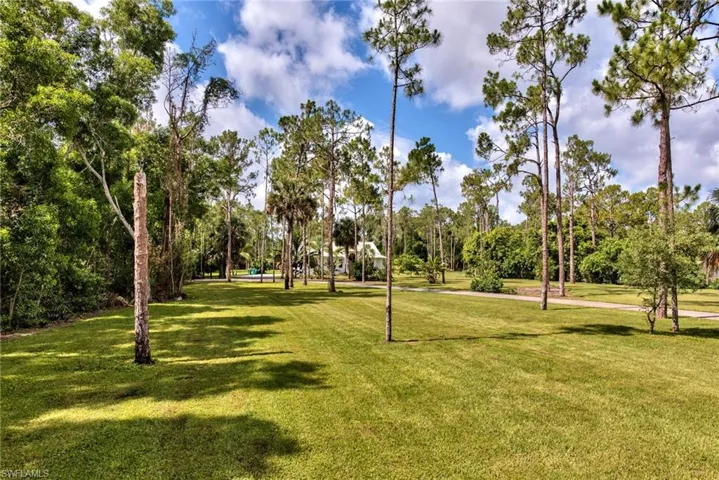 Surrounding community featuring a lawn