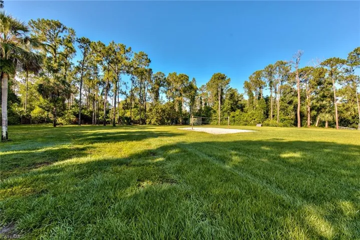 View of yard with volleyball court