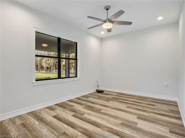 Unfurnished room with wood finished floors, recessed lighting, and a ceiling fan