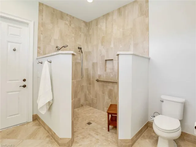 Full bathroom featuring walk in shower and tile patterned flooring