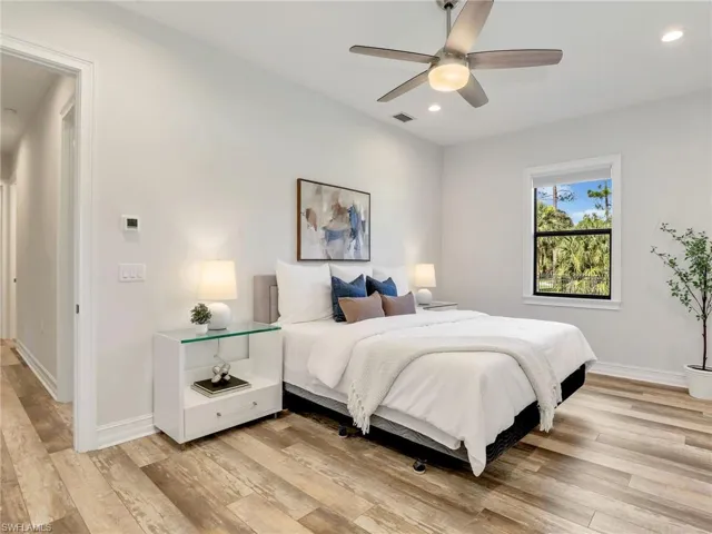 Bedroom featuring recessed lighting, light wood-style flooring, and a ceiling fan