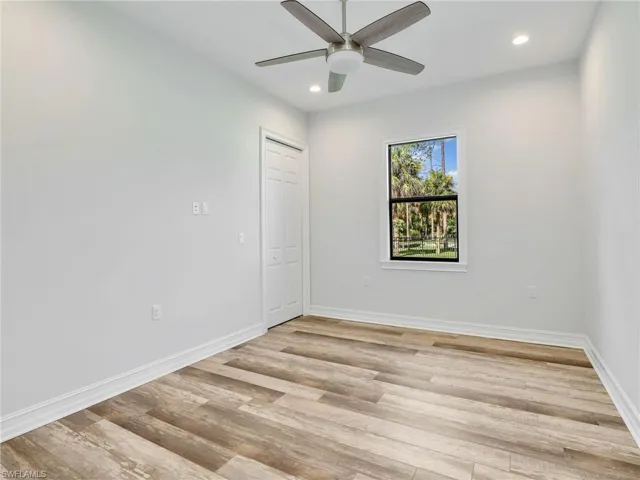 Empty room featuring light wood-style floors, recessed lighting, and ceiling fan