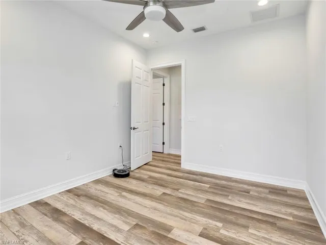 Unfurnished room with recessed lighting, light wood finished floors, and a ceiling fan