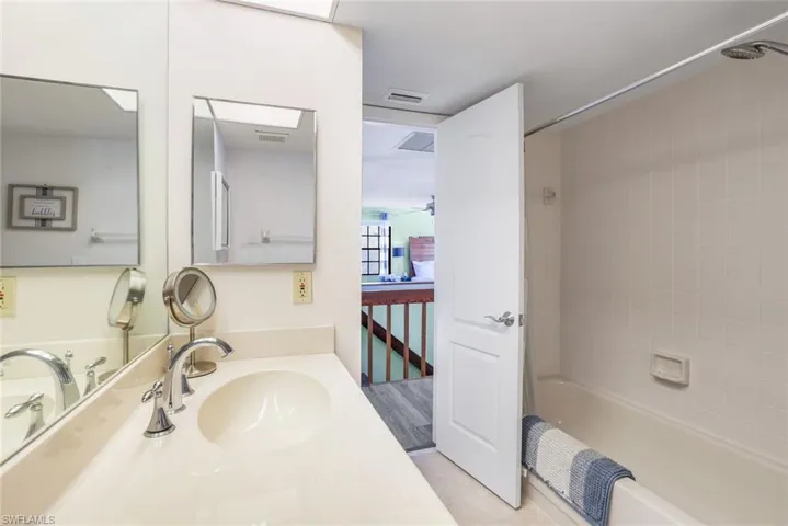 Full bath with shower / tub combo and vanity