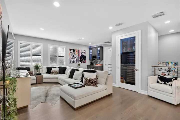 Living room featuring wood finished floors and recessed lighting